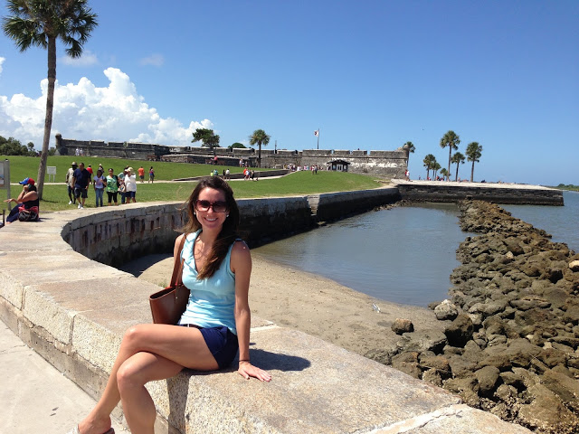Blogger Stephanie Ziajka of Diary of a Debutante by the Castillo de San Marcos National Monument in St Augustine, Florida