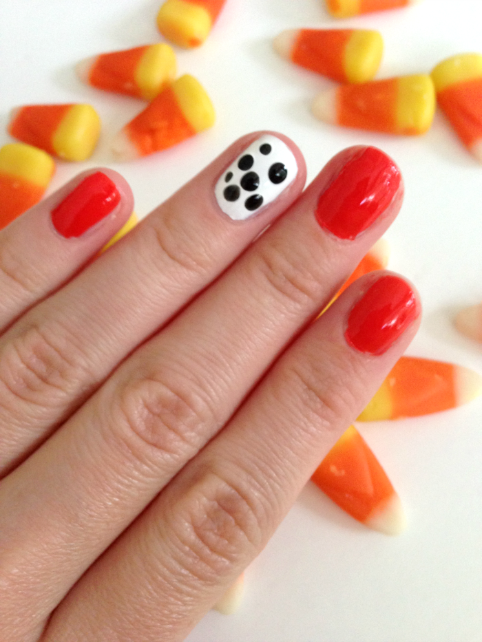 A freakishly simple Halloween nail art design featuring Sally Hansen Xtreme Wear Hot Tamale, OPI Black Onyx, and Sinful Colors Snow Me White polish