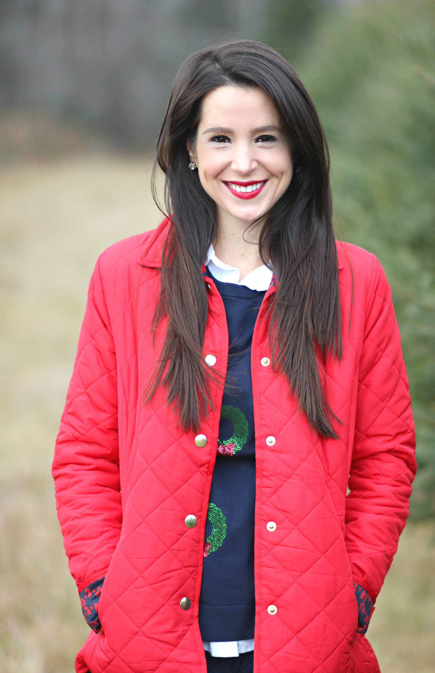 Cutting down our Christmas tree in the perfect affordable quilted red jacket from Crown & Ivory