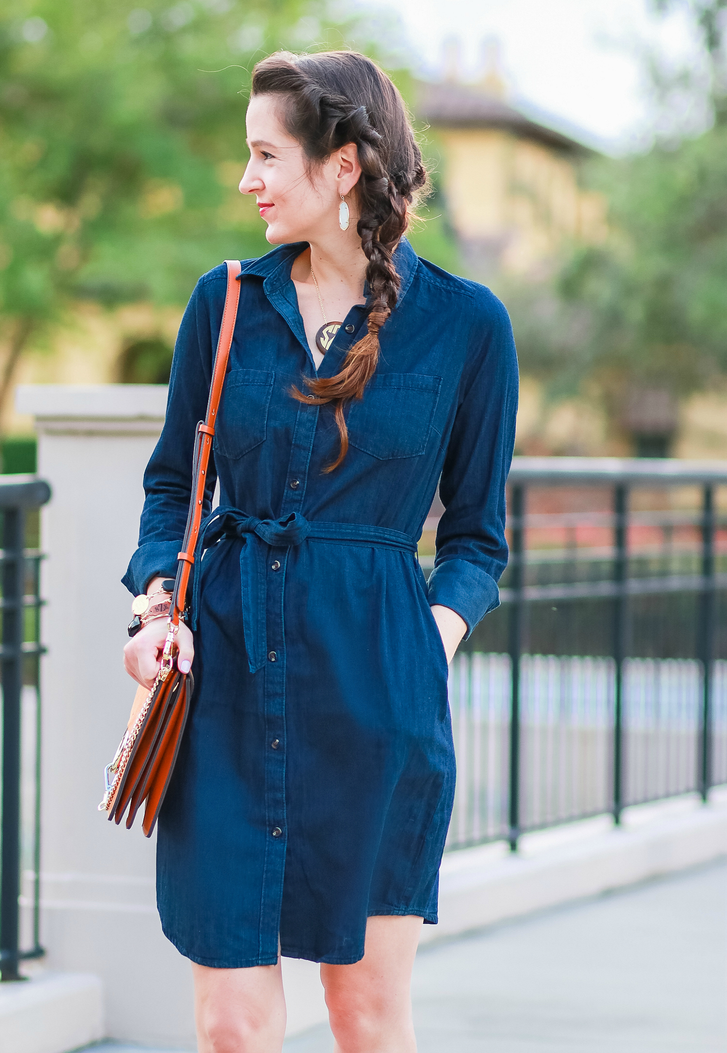 Cute casual tailgating outfit and easy side braid hairstyle | Twisted side braid hair tutorial | Target denim shirt dress with cognac booties, a Chleo Faye lookalike bag, and monogrammed jewelry | Fall Hairstyle to Try: Simple Twisted Side Braid from Hair Cuttery by southern blogger Stephanie Ziajka from Diary of a Debutante