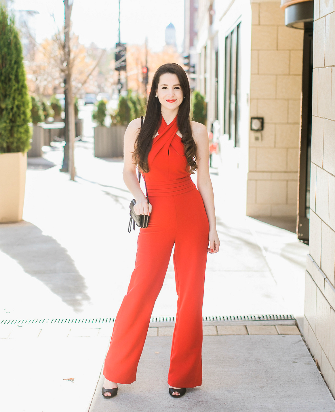 Adelyn Rae red dressy jumpsuit styled with a black Vera Bradley RFID All-in-One Crossbody bag and Nina Shoes peep toe sandals by southern fashion blogger Stephanie Ziajka from Diary of a Debutante