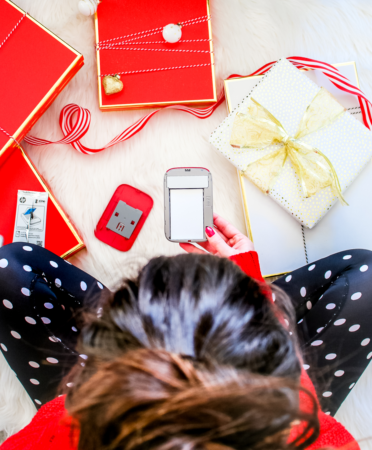 Red HP Sprocket Photo Printer, which makes a perfect stocking stuffer and is the best instant photo printer for events and travel by southern blogger Stephanie Ziajka from Diary of a Debutante