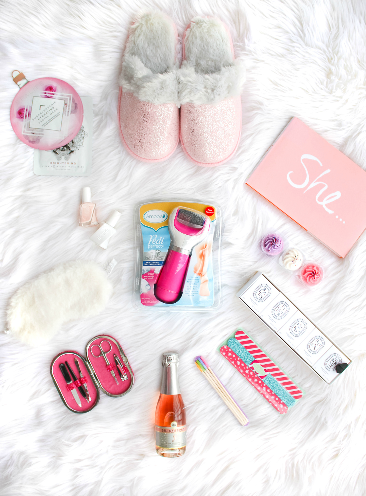 DIY spa gift basket consisting of 12 self care gift ideas she's guaranteed to love, including the Amope Pedi Perfect Foot File, by southern blogger Stephanie Ziajka from Diary of a Debutante