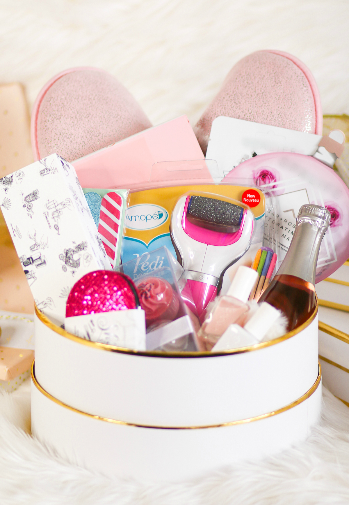 DIY spa gift basket consisting of 12 self care gift ideas she's guaranteed to love, including the Amope Pedi Perfect Foot File, by southern blogger Stephanie Ziajka from Diary of a Debutante