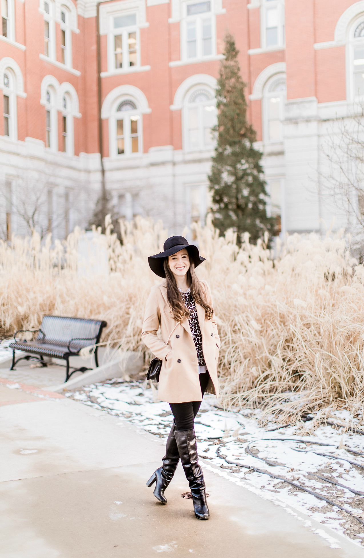 Affordable camel coat from Shein worn with black Mott and Bow skinny jeans, J.Crew Factory leopard crewneck sweater, J.Crew Factory white oxford, Sakkas black wool floppy hat, Nine West black tall boots, and Rebecca Minkoff Love Crossbody purse styled by fashion blogger Stephanie Ziajka from Diary of a Debutante