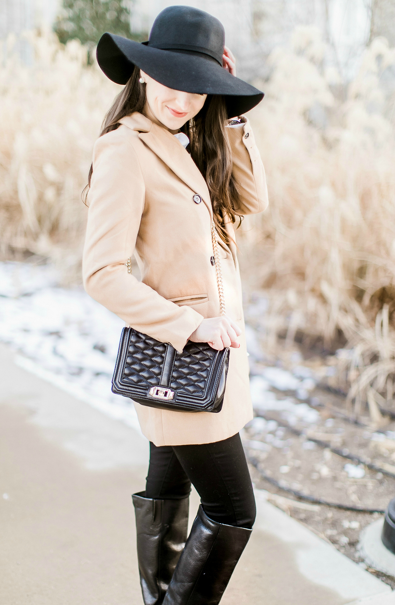 Affordable camel coat from Shein worn with black Mott and Bow skinny jeans, J.Crew Factory leopard crewneck sweater, J.Crew Factory white oxford, Sakkas black wool floppy hat, Nine West black tall boots, and Rebecca Minkoff Love Crossbody purse styled by fashion blogger Stephanie Ziajka from Diary of a Debutante