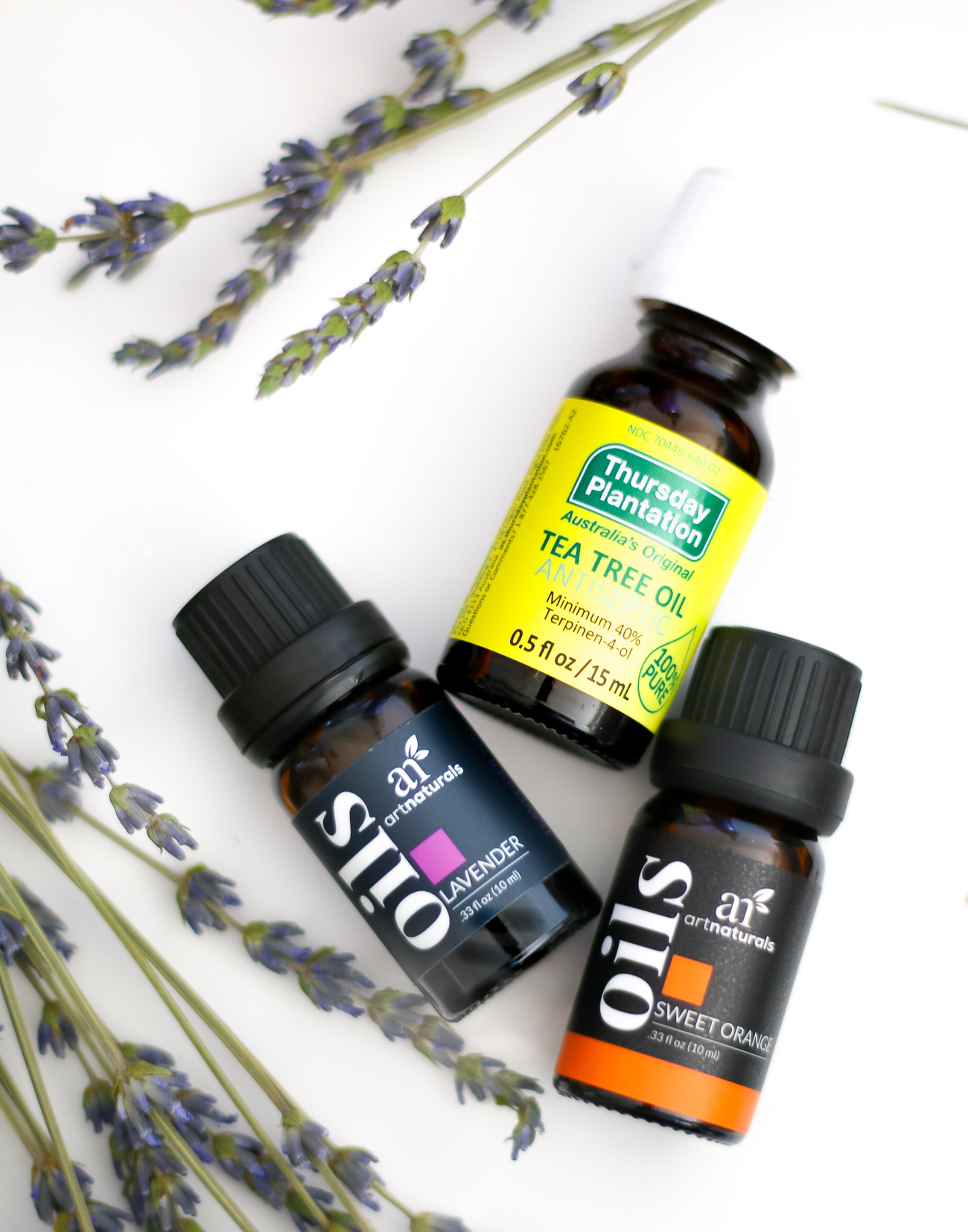 DIY essential oil linen spray by southern fashion blogger Stephanie Ziajka from Diary of a Debutante, DIY laundry spray with lavender, sweet orange, and tea tree oil from Thursday Plantation
