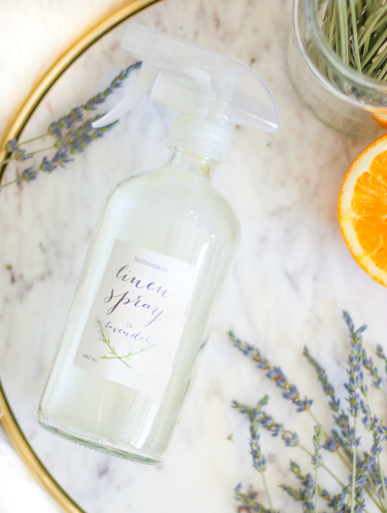 DIY essential oil linen spray by southern fashion blogger Stephanie Ziajka from Diary of a Debutante, DIY laundry spray with lavender, sweet orange, and tea tree oil from Thursday Plantation