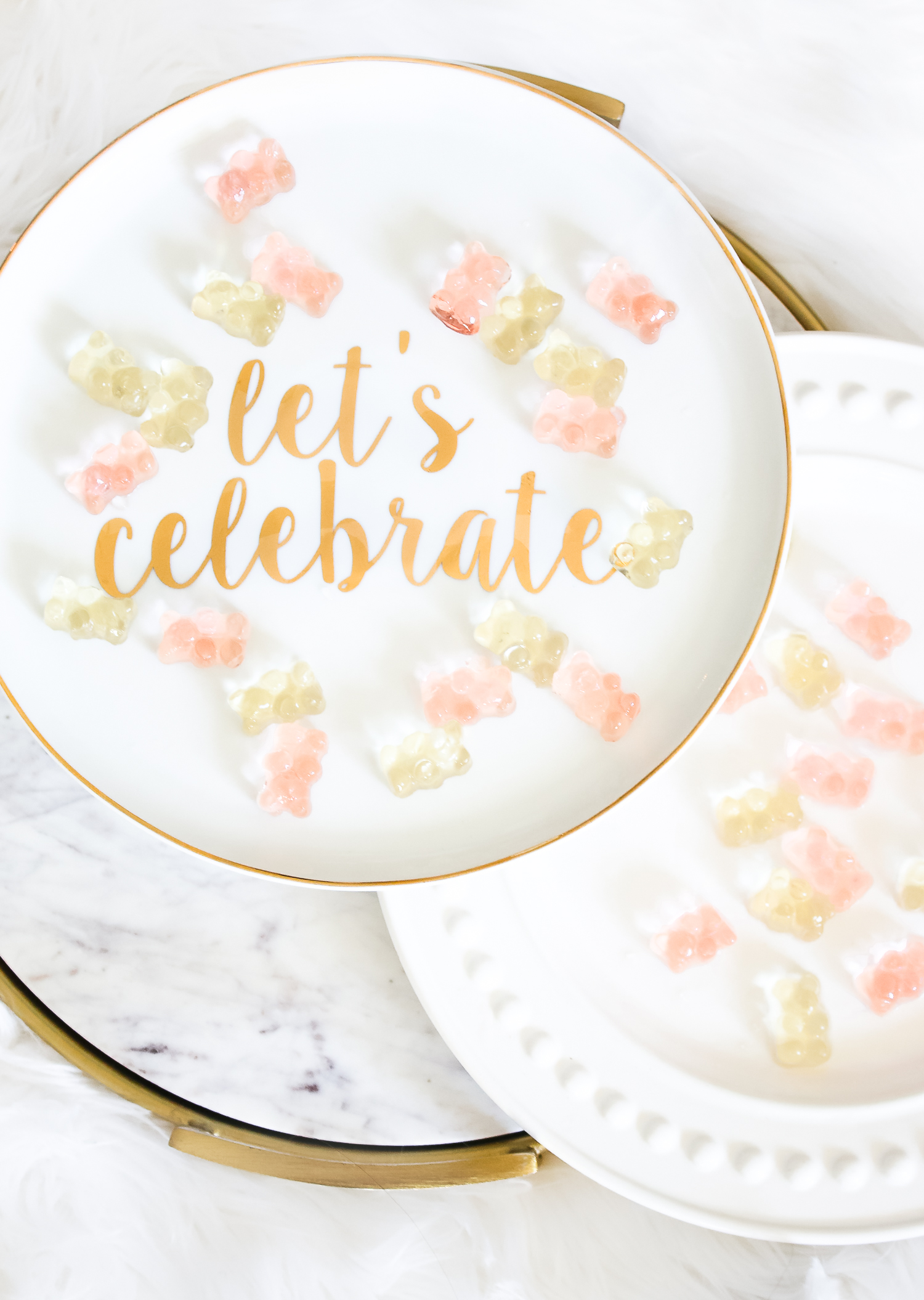 How to make champagne gummy bears by southern lifestyle blogger Stephanie Ziajka from Diary of a Debutante, easy champagne soaked gummy bears recipe using Sugarfina Champagne Bears Gummy Candy, ceramic Let's Celebrate cake stand