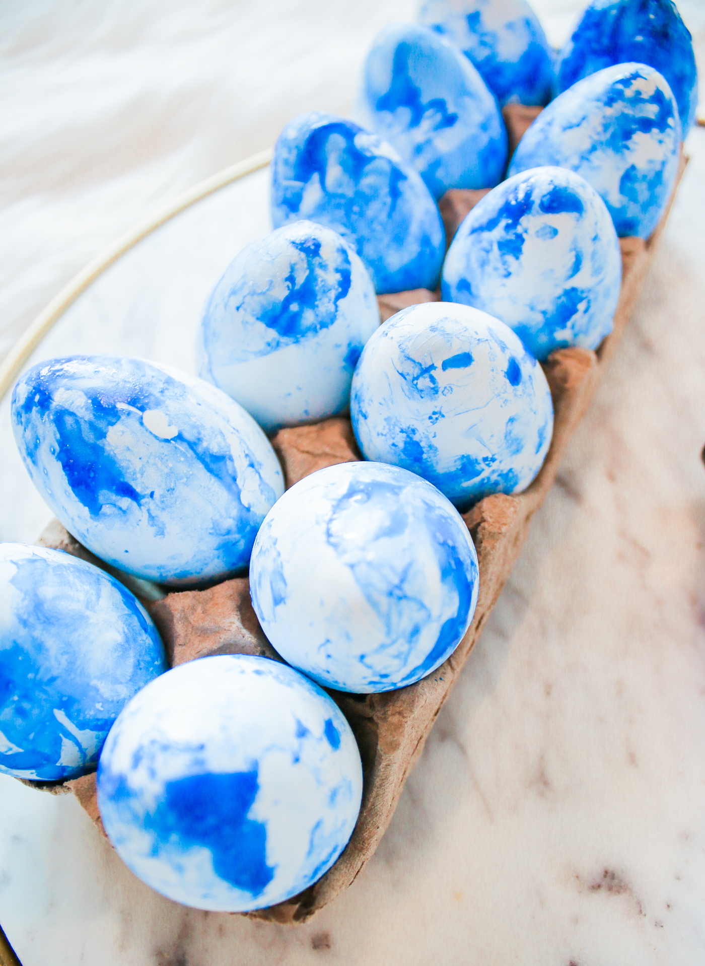 Easter Flair: DIY Blue Marbled Easter Eggs by southern lifestyle blogger Stephanie Ziajka from Diary of a Debutante, Southern Living projects, marbled easter eggs, nail polish easter eggs, diy marbled easter eggs, blue marbled easter eggs
