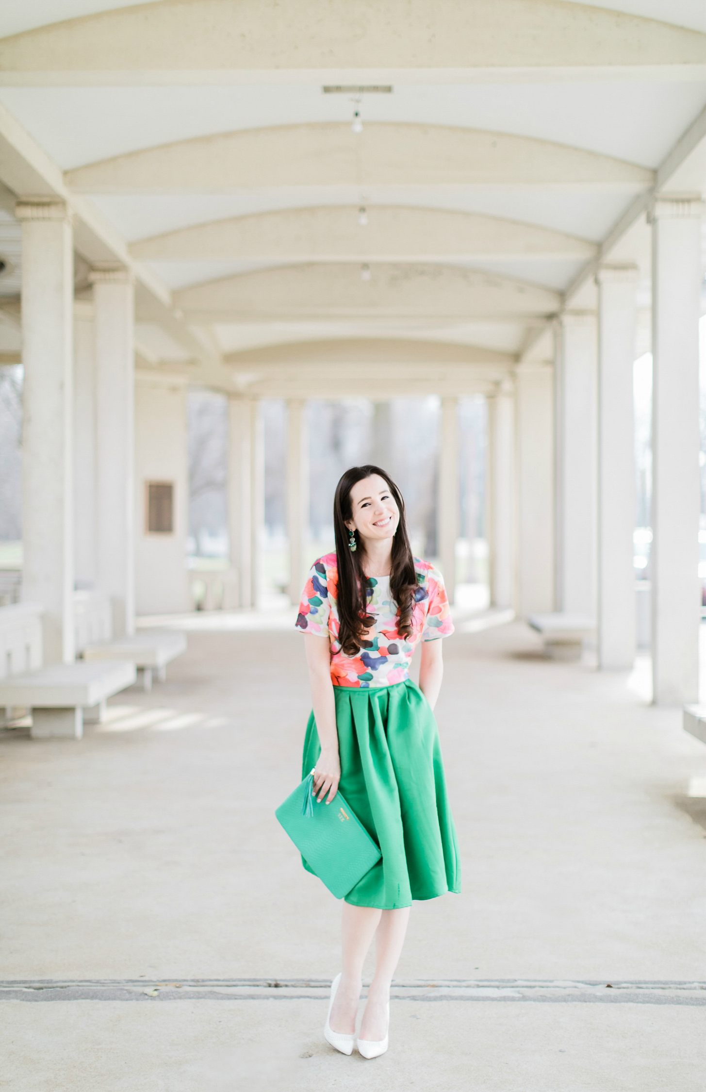 Why We Should Embrace Modesty in Modern Fashion by southern fashion blogger Stephanie Ziajka from Diary of a Debutante, kelly green a-line skirt styled with a colorful calico print crop top, white Sam Edelman pointed toe pumps, and a green monogrammed GiGi New York Uber clutch, modest outfit for women, modest dresses and skirts for women