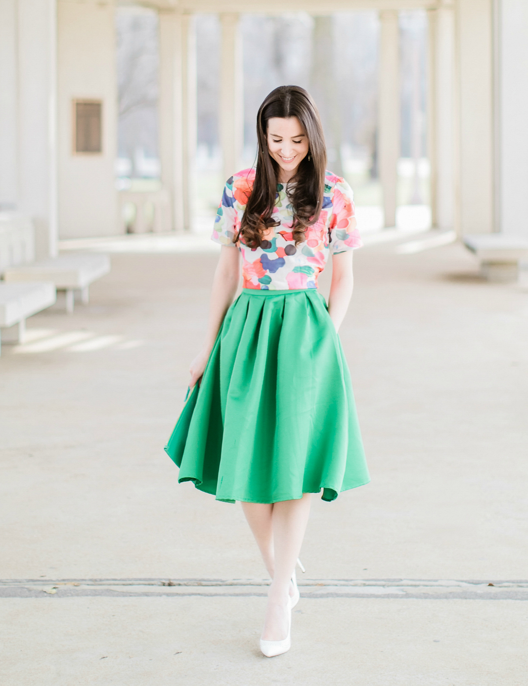 Why We Should Embrace Modesty in Modern Fashion by southern fashion blogger Stephanie Ziajka from Diary of a Debutante, kelly green a-line skirt styled with a colorful calico print crop top, white pointed toe pumps, and a green monogrammed GiGi New York Uber clutch, modest outfit for women, modest dresses and skirts for women