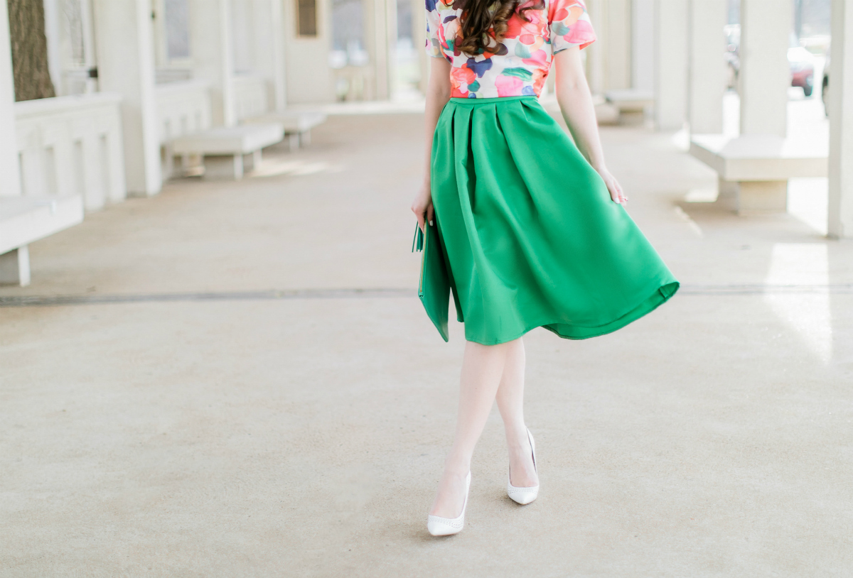 Why We Should Embrace Modesty in Modern Fashion by southern fashion blogger Stephanie Ziajka from Diary of a Debutante, kelly green a-line skirt styled with a colorful calico print crop top, white pointed toe pumps, and a green monogrammed GiGi New York Uber clutch, modest outfit for women, modest dresses and skirts for women