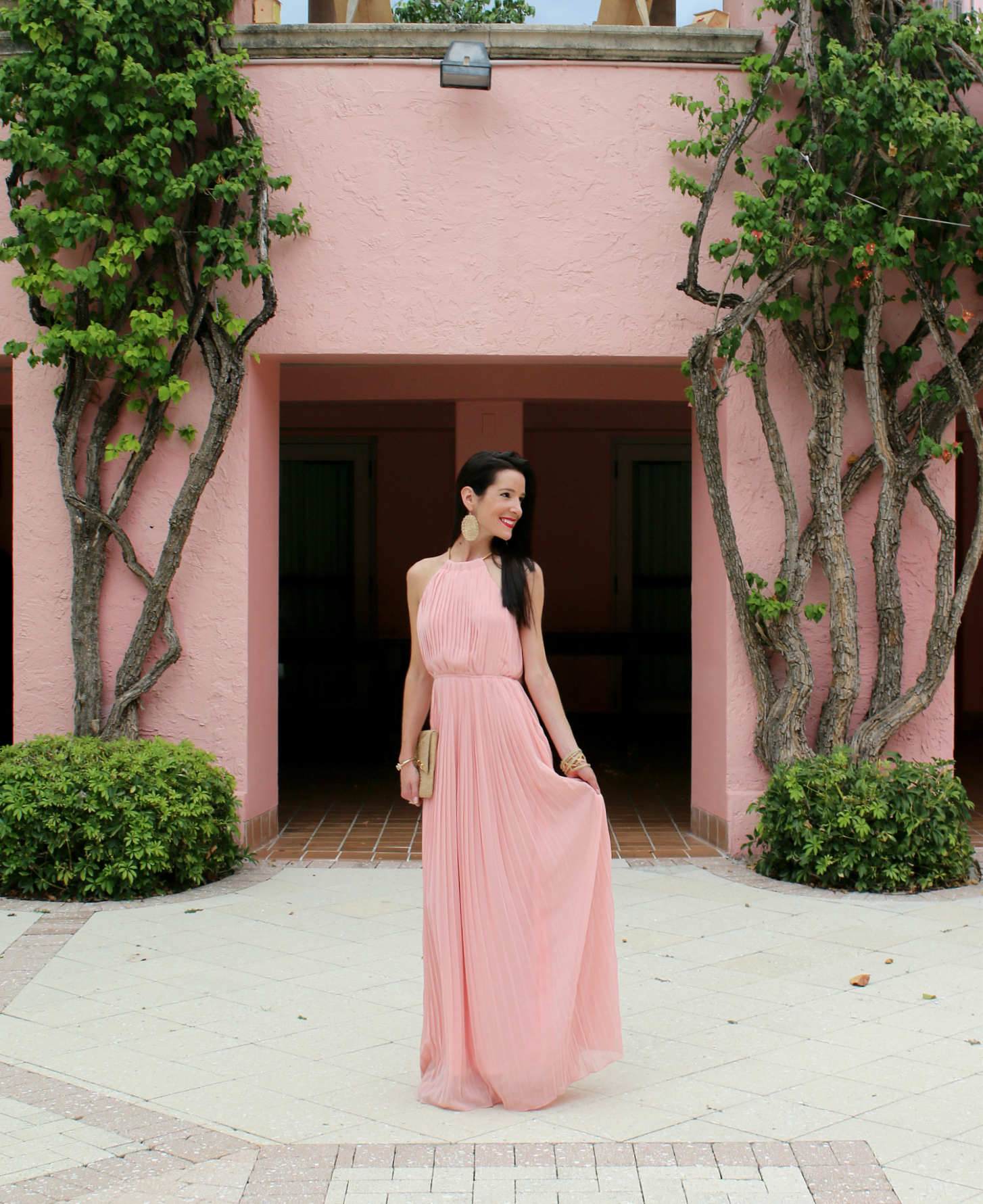 Best Dresses to Wear to a Spring Wedding by southern fashion blogger Stephanie Ziajka from Diary of a Debutante, spring wedding guest outfits, wedding guest dress ideas, dresses to wear to a spring wedding, pink pleated halter top maxi dress