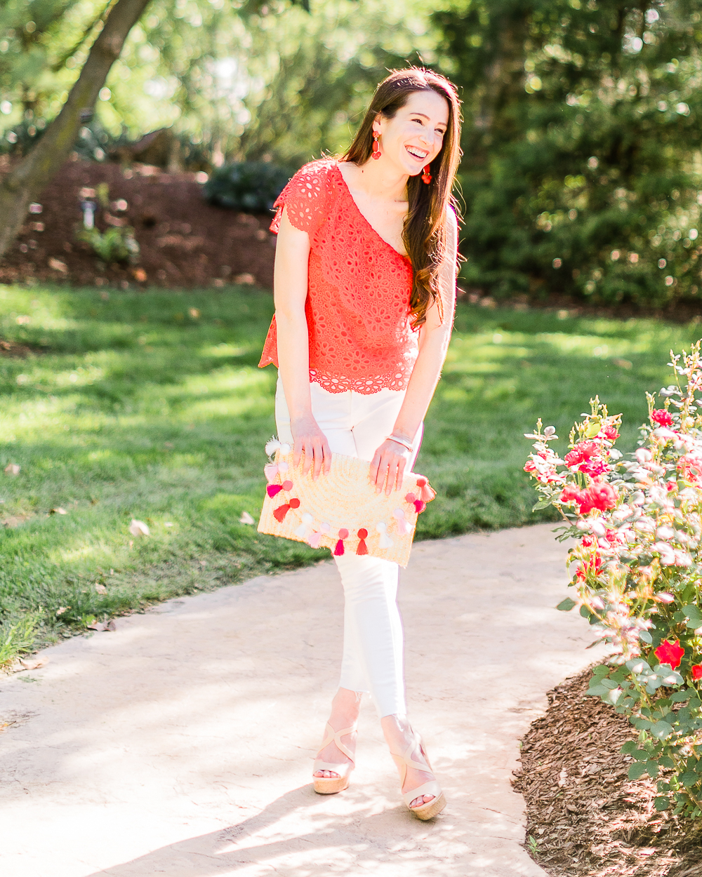 What to wear over Memorial Day Weekend by southern fashion blogger Stephanie Ziajka from Diary of a Debutante, Memorial Day outfit idea, BB Dakota Lolita top styled with white Levi's ankle skinny jeans, Madden nude wedges, Amazon straw tassel clutch, Amazon red beaded earrings, and Kendra Scott Aubrey mixed metals bangle bracelet set
