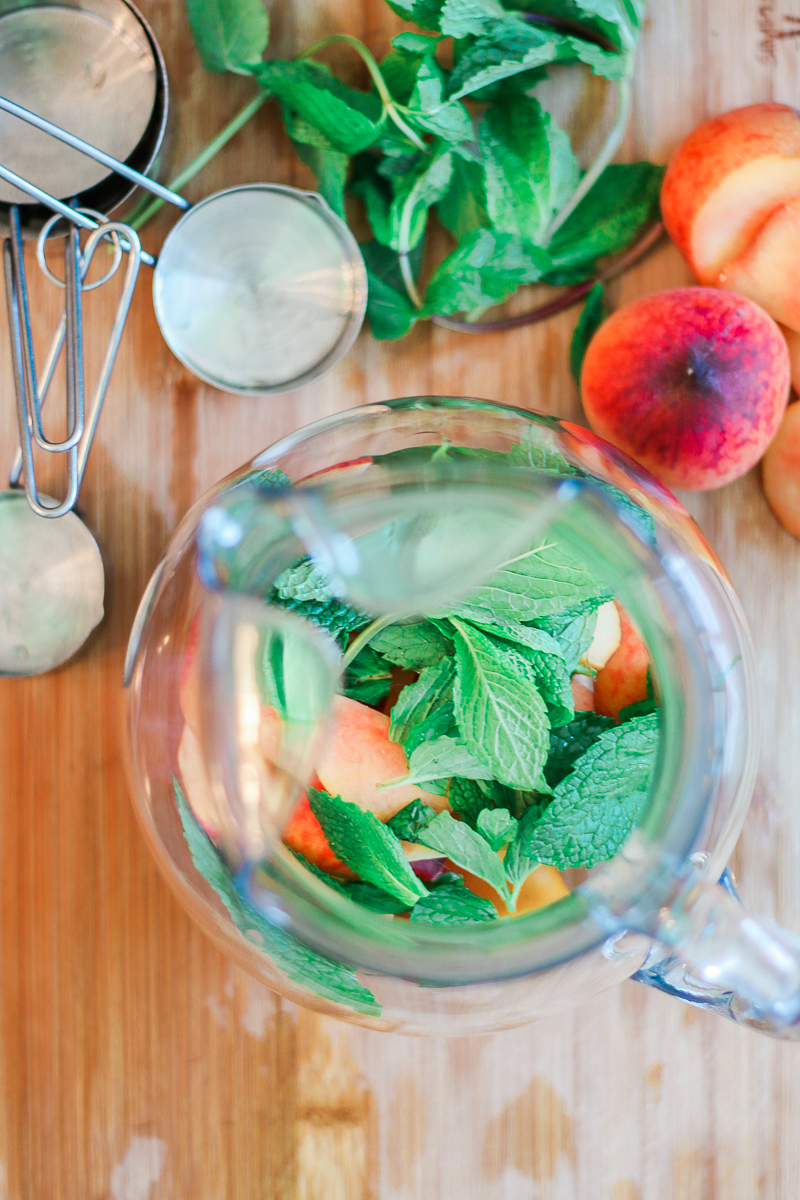 Skinny peach mint cocktail made with Peach Perrier and organic blue agave by southern blogger Stephanie Ziajka from Diary of a Debutante, skinny peach mojito recipe, summer cocktail with flavored carbonated water, Perrier flavors