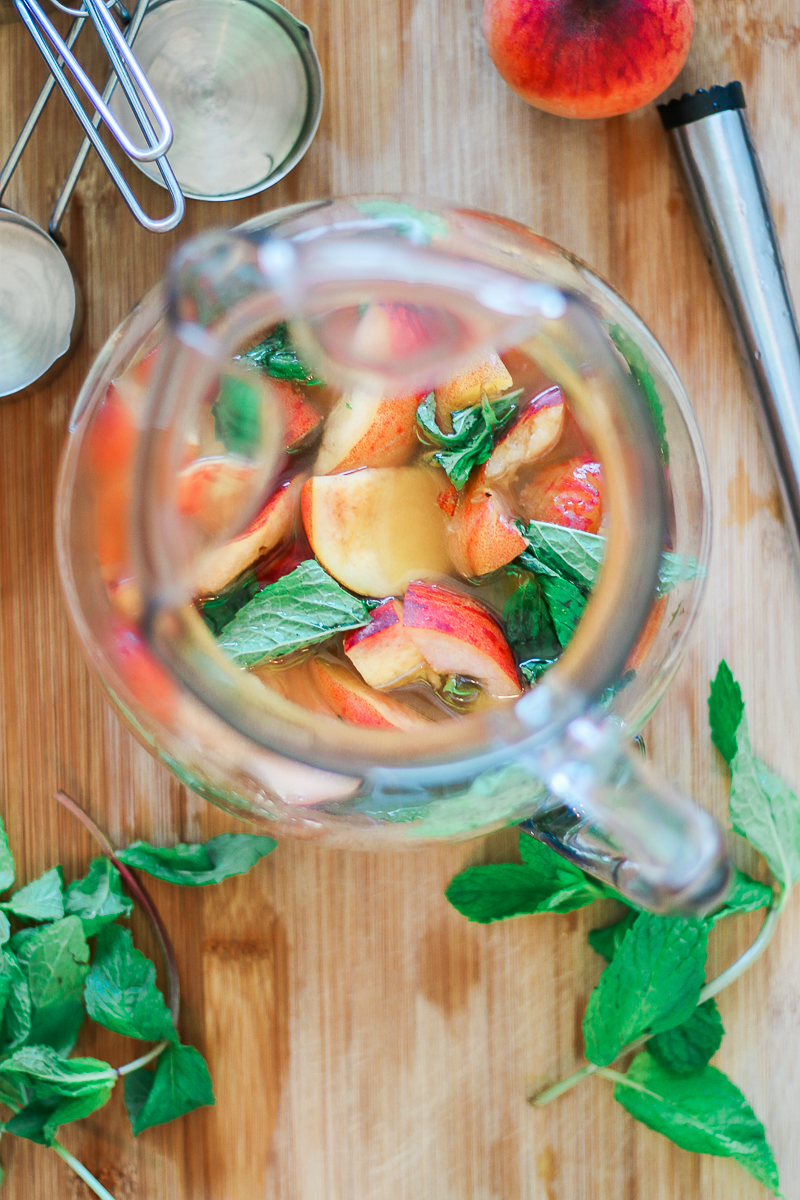 Skinny peach mint cocktail made with Peach Perrier and organic blue agave by southern blogger Stephanie Ziajka from Diary of a Debutante, skinny peach mojito recipe, summer cocktail with flavored carbonated water, Perrier flavors