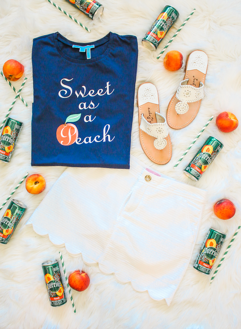 Draper James Sweet as a Peach shirt, Lilly Pulitzer white scalloped skirt, white Jack Rogers sandals, Skinny peach mint cocktail made with Peach Perrier and organic blue agave by southern blogger Stephanie Ziajka from Diary of a Debutante, skinny peach mojito recipe, summer cocktail with flavored carbonated water, Perrier flavors