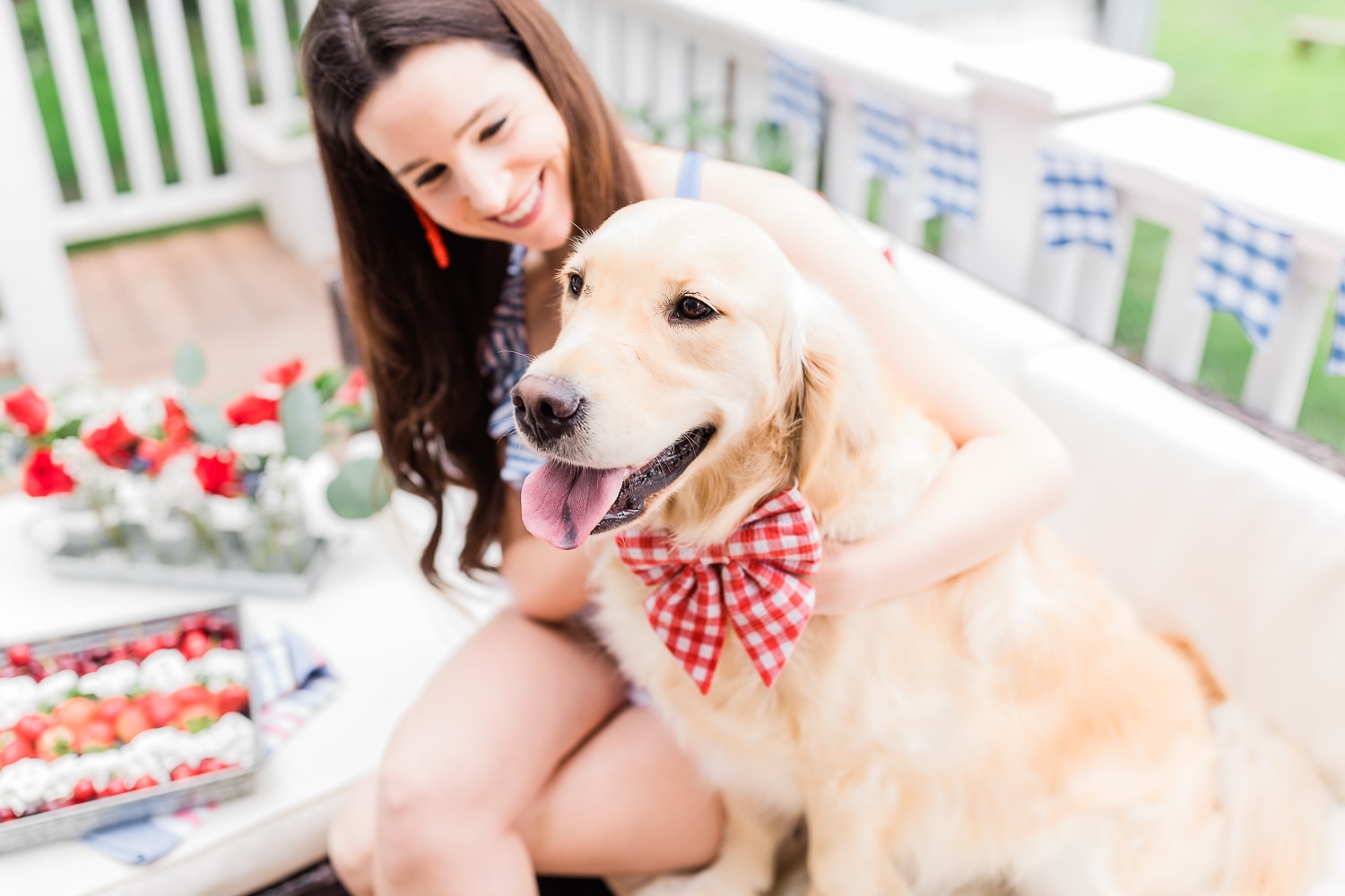 Nala the 4th of July golden retriever posing in her red gingham dog bow and collar on Diary of a Debutante