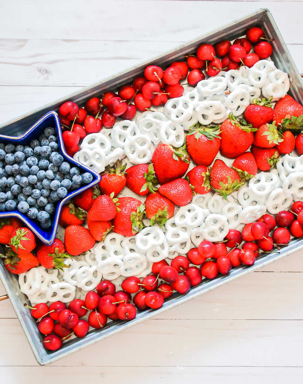 Blogger Stephanie Ziajka shares a healthy American flag tray with fruit and yogurt-covered pretzels on Diary of a Debutante