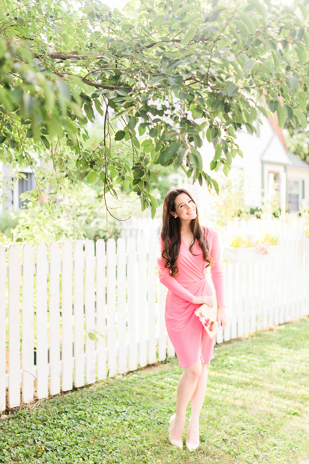 What to wear to a fall baby shower by affordable style blogger Stephanie Ziajka from Diary of a Debutante, what to wear to a baby shower in October, what to wear for gender reveal, how to dress for breast cancer awareness, pink Lark & Ro wrap dress with pink straw tassel clutch and M. Gemi The Cammeo pumps
