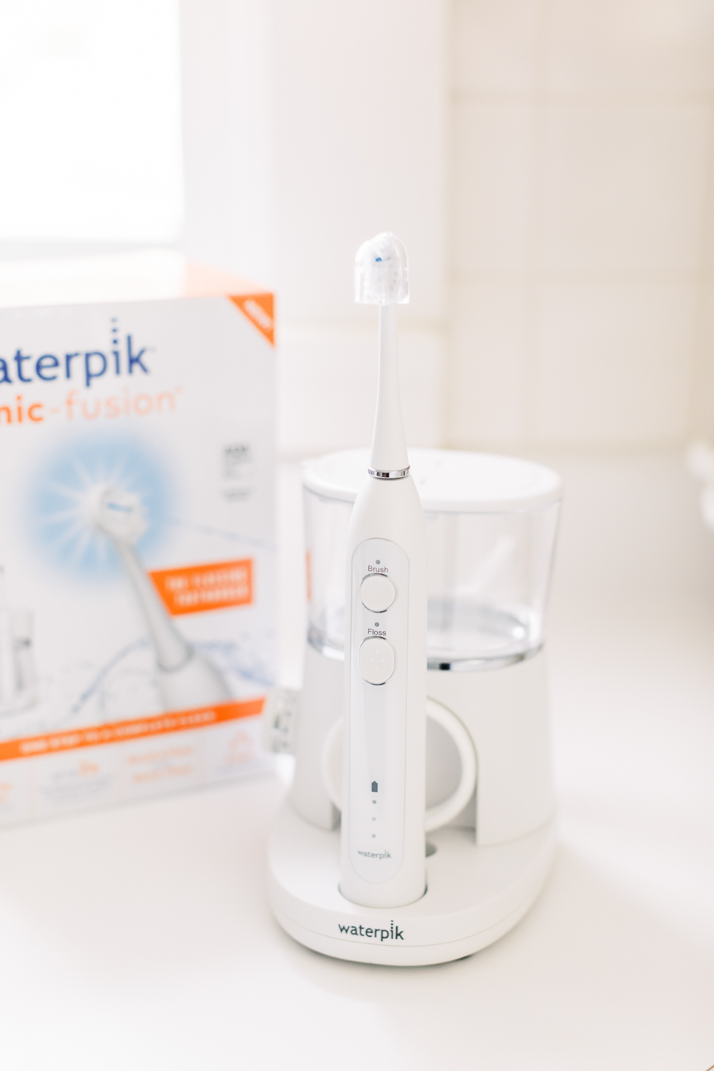Waterpik Sonic Fusion Flossing Toothbrush, Sonic-Fushion Flossing Toothbrush Review by popular southern lifestyle blogger Stephanie Ziajka from Diary of a Debutante, morning self-care routine, drinking coffee on the couch, pink silk pajama set
