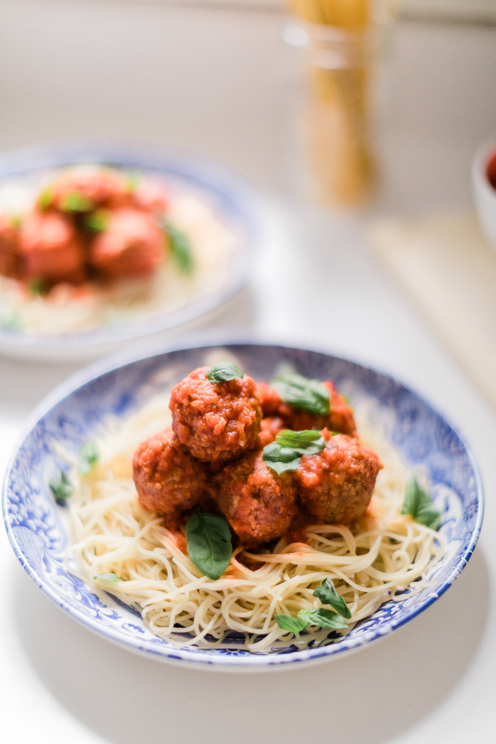 Spaghetti and Pure Farmland Plant-Based Meatballs Recipe by affordable entertaining blogger Stephanie Ziajka from Diary of a Debutante, blue and white Italian tablescape