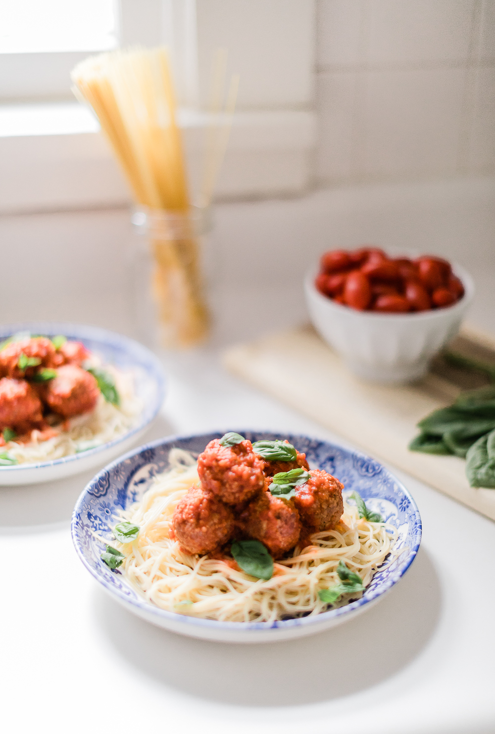 Spaghetti and Pure Farmland Plant-Based Meatballs Recipe by affordable entertaining blogger Stephanie Ziajka from Diary of a Debutante, blue and white Italian tablescape