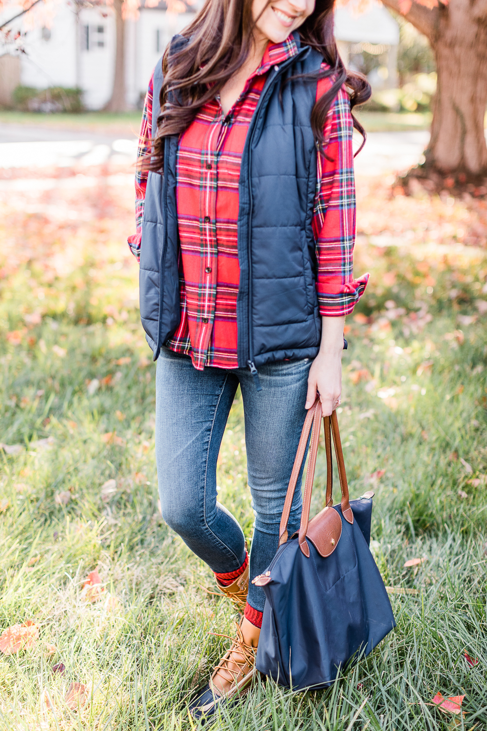 LL Bean Royal Stewart Tartan Relaxed Flannel styled with Classic Bean Boots, Navy Amazon Essentials Puffer Vest, AG Ankle Skinny Jeans, and a Navy Longchamp Le Pliage Tote by popular affordable fashion blogger Stephanie Ziajka on Diary of a Debutante, best LL Bean purchases, favorite LL Bean winter fashion finds 