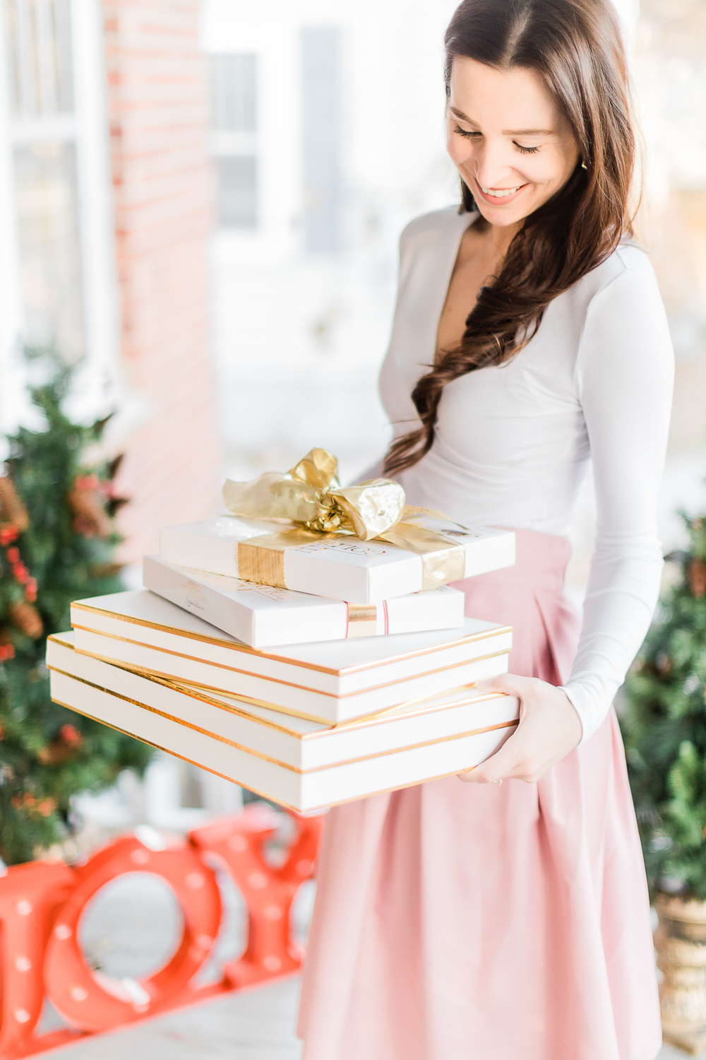 Cyber Monday 2019 Sales Guide, best Cyber Monday deals, best Cyber Monday style deals, best Cyber Monday beauty deals, best Cyber Monday home deals, gold Christmas wrapping ideas, girl holding presents, popular affordable fashion blogger Stephanie Ziajka, Diary of a Debutante