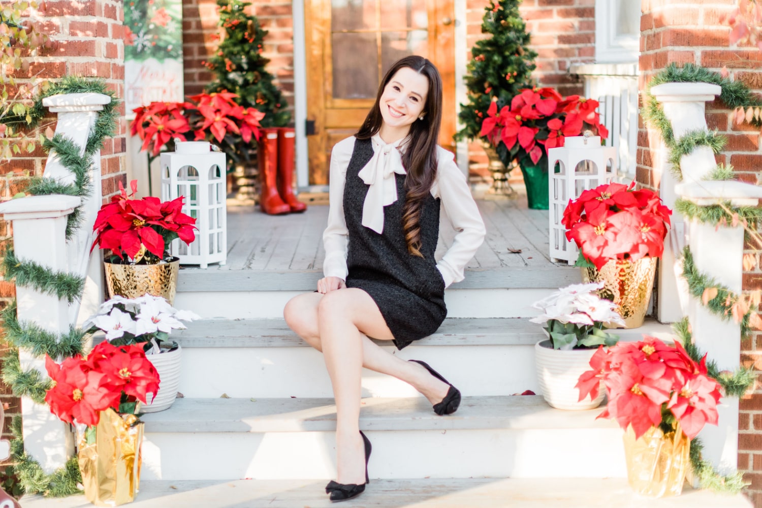 Affordable fashion blogger Stephanie Ziajka styles a black shift dress with a white tie-neck chiffon blouse and black pointed toe bow pumps on Diary of a Debutante