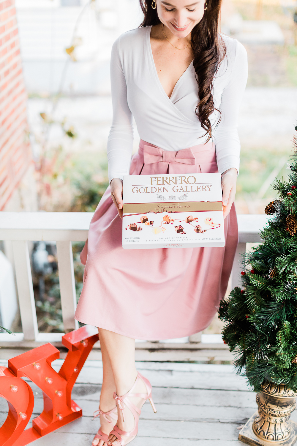 Holiday Hostess Gift Idea, Ferrero Golden Gallery Signature Chocolates, pink bow skirt, dressy pink pumps, popular lifestyle blog Diary of a Debutante, popular lifestyle blogger Stephanie Ziajka