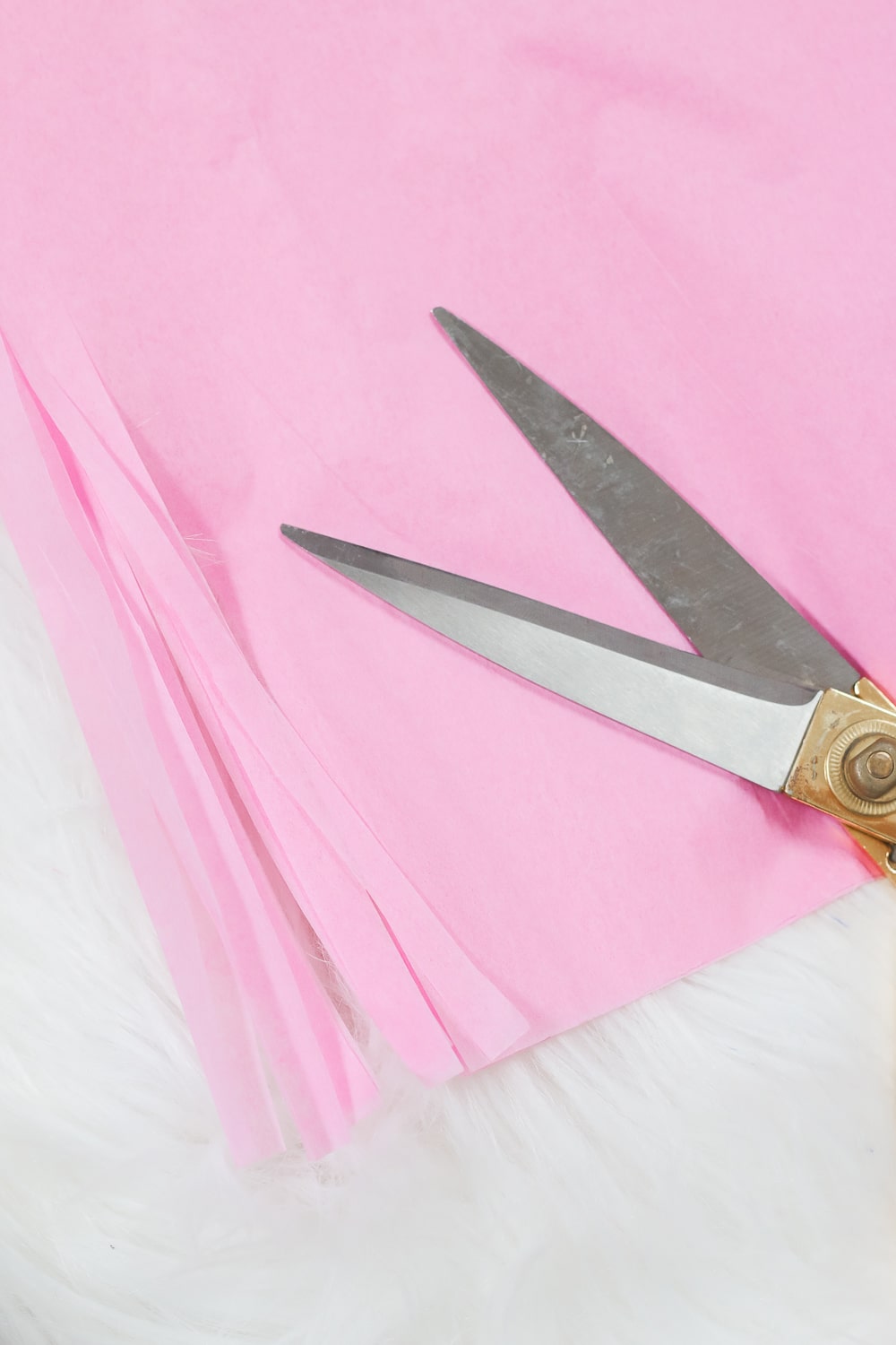 Step 2 of DIY blogger Stephanie Ziajka's DIY tassels tissue paper tutorial on Diary of a Debutante