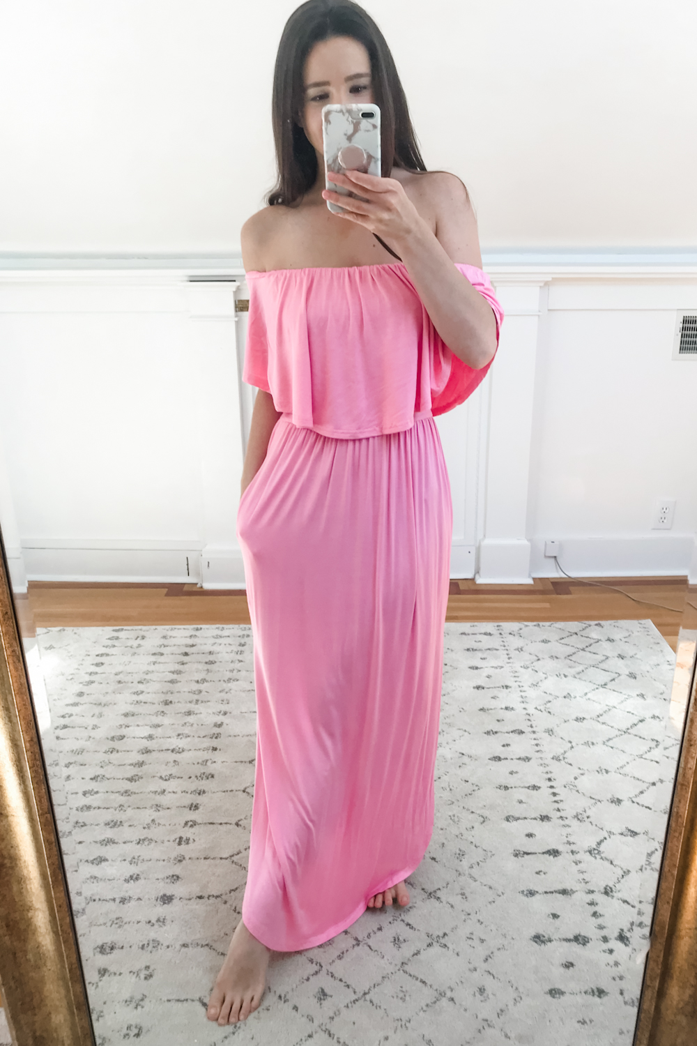 Affordable fashion blogger Stephanie Ziajka tries on a pink Amazon off shoulder ruffle maxi dress with pockets on Diary of a Debutante