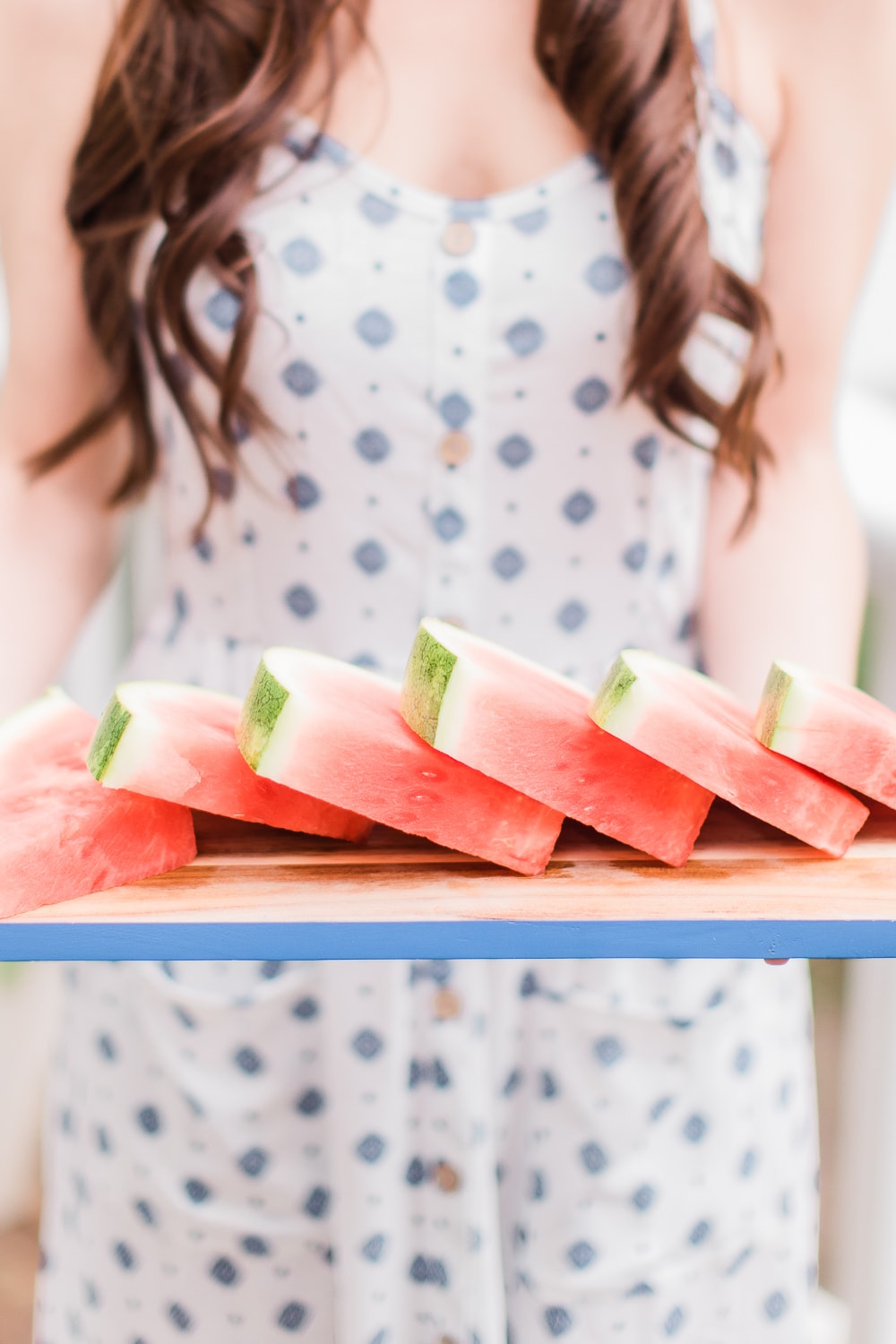Lifestyle blogger Stephanie Ziajka shares a best of May 2020 roundup, where she shares the top 10 things she found during the month of May 2020, on Diary of a Debutante, girl holding watermelon tray
