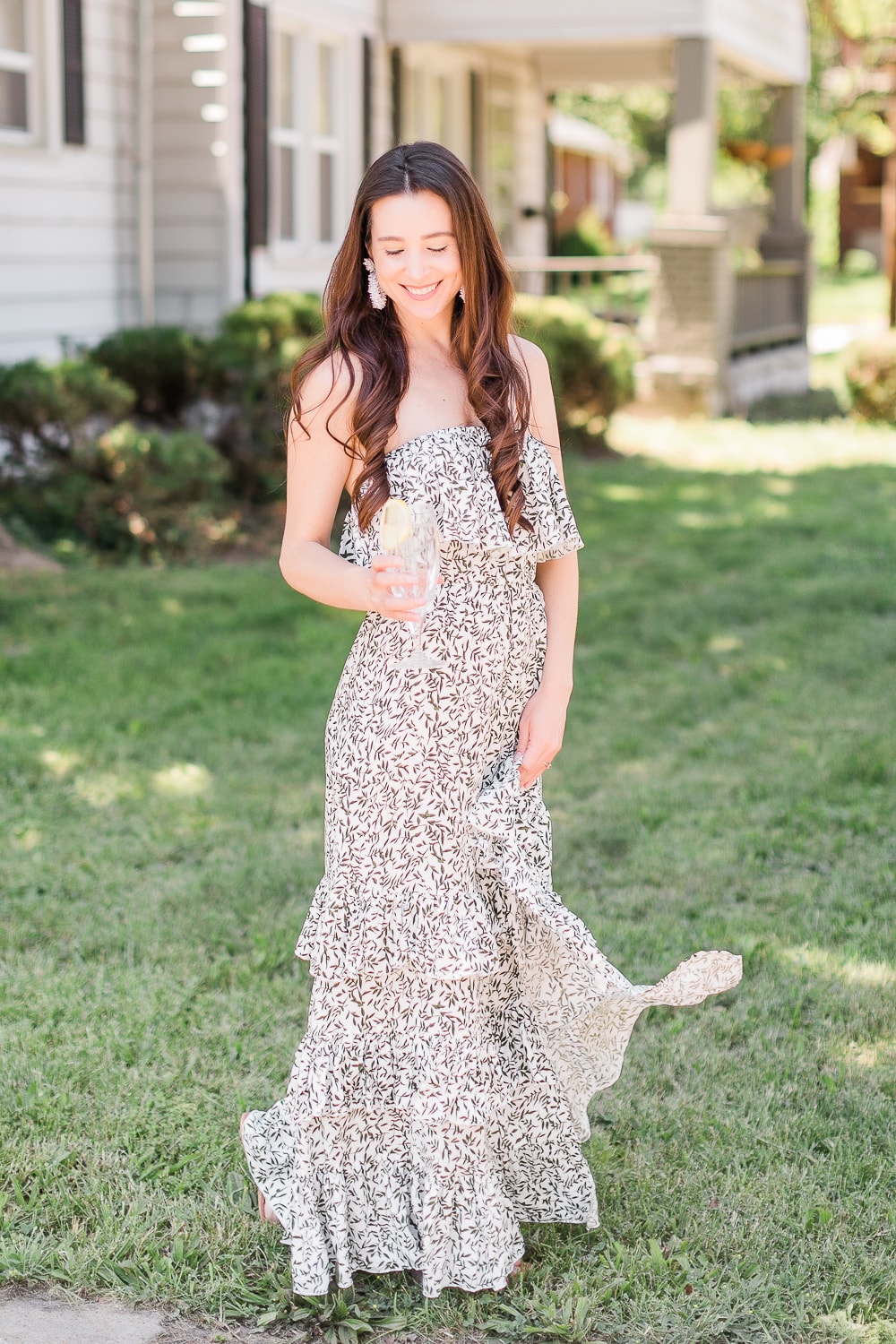 Strapless green ruffle maxi dress styled with nude sandals and white beaded statement earrings by affordable fashion blogger Stephanie Ziajka on Diary of a Debutante