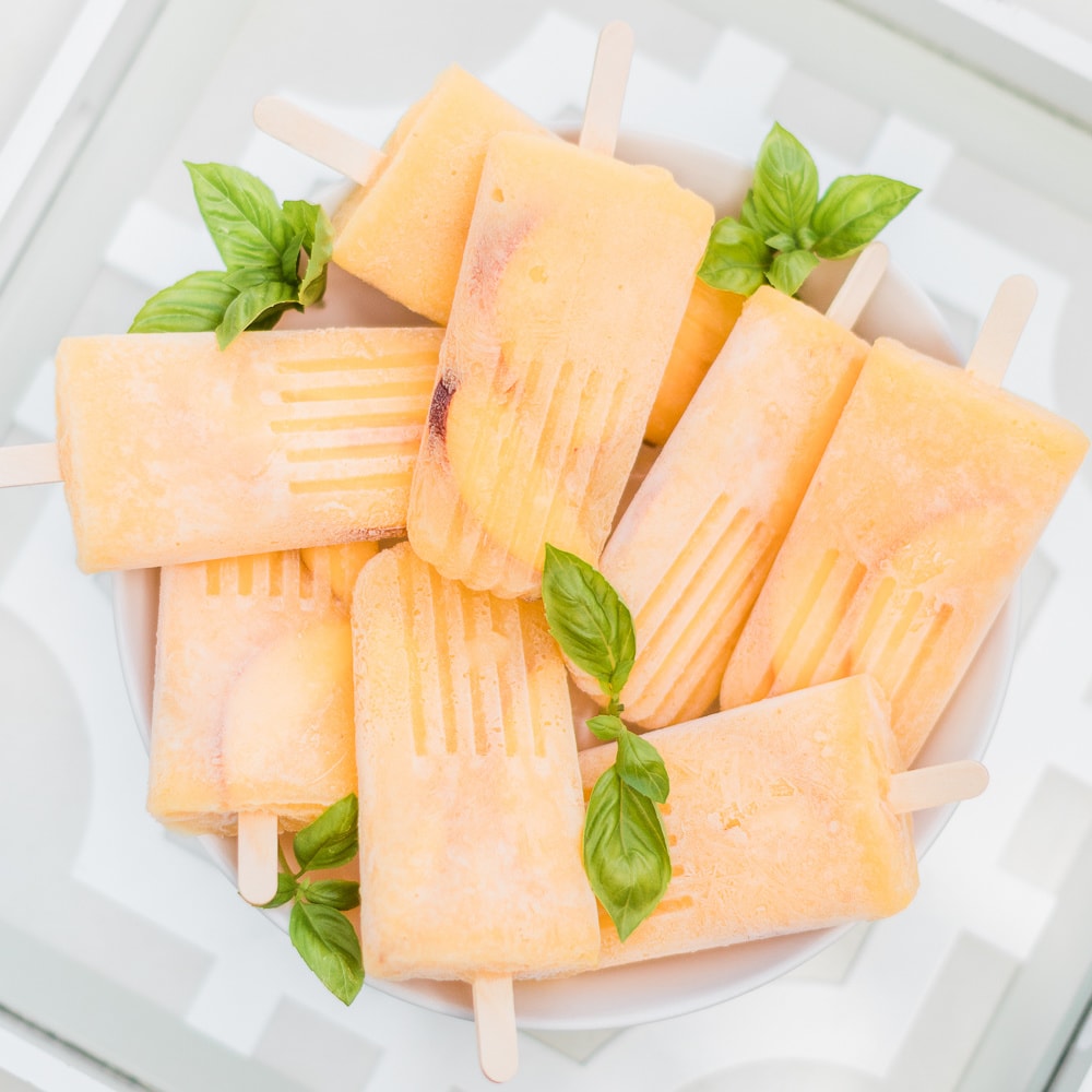 boozy bellini popsicle recipe by southern lifestyle blogger Stephanie Ziajka on Diary of a Debutante