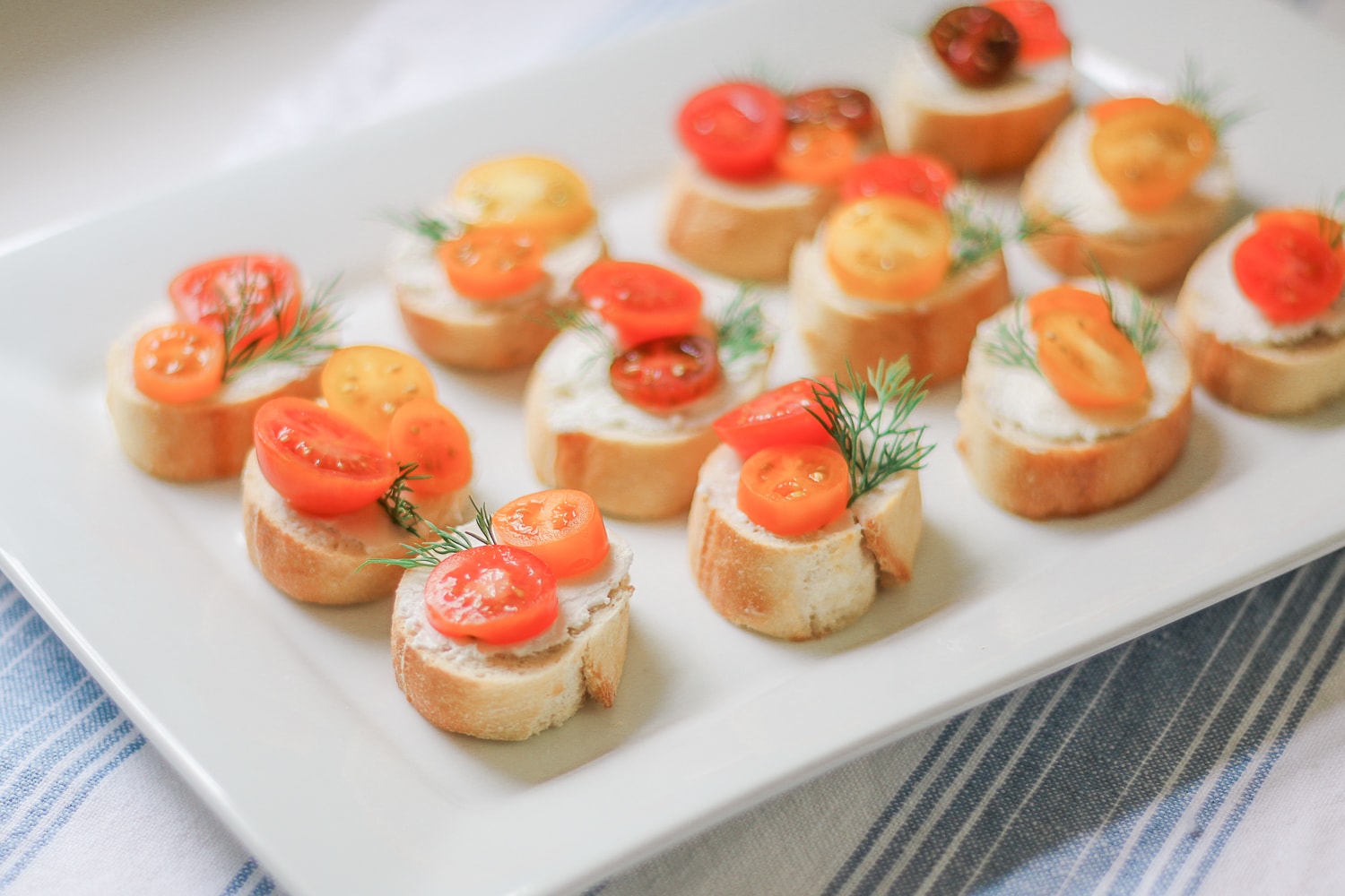 Southern lifestyle blogger Stephanie Ziajka shares a colorful tomato and goat cheese crostini recipe using NatureSweet Constellation tomatoes on Diary of a Debutante