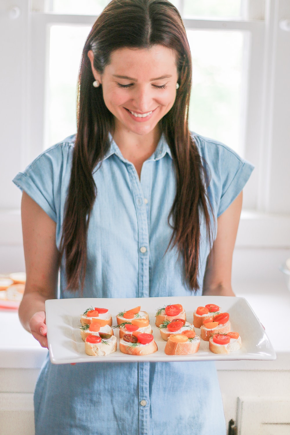 Southern lifestyle blogger Stephanie Ziajka shares one of her favorite crostini recipes with goat cheese and tomatoes on Diary of a Debutante
