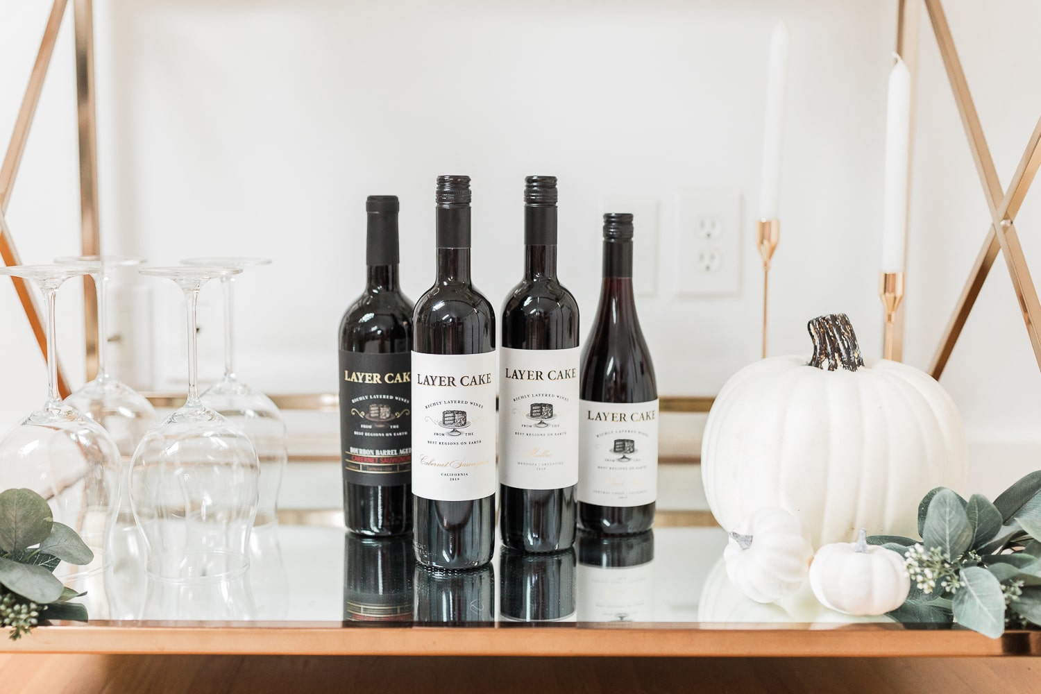 Layer Cake Cabernet Sauvignon, Layer Cake Malbec, Layer Cake Pinot Noir, and Layer Cake Bourbon Barrel Cabernet Sauvignon styled on a fall bar cart by blogger Stephanie Ziajka on Diary of a Debutante 