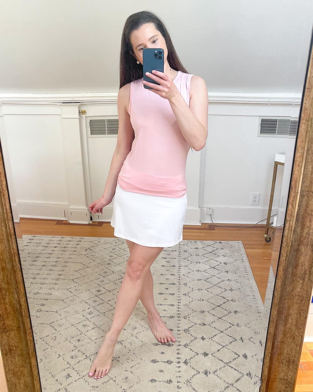Amazon white tennis skirt and Amazon pink open back workout tank worn by affordable fashion blogger Stephanie Ziajka on Diary of a Debutante