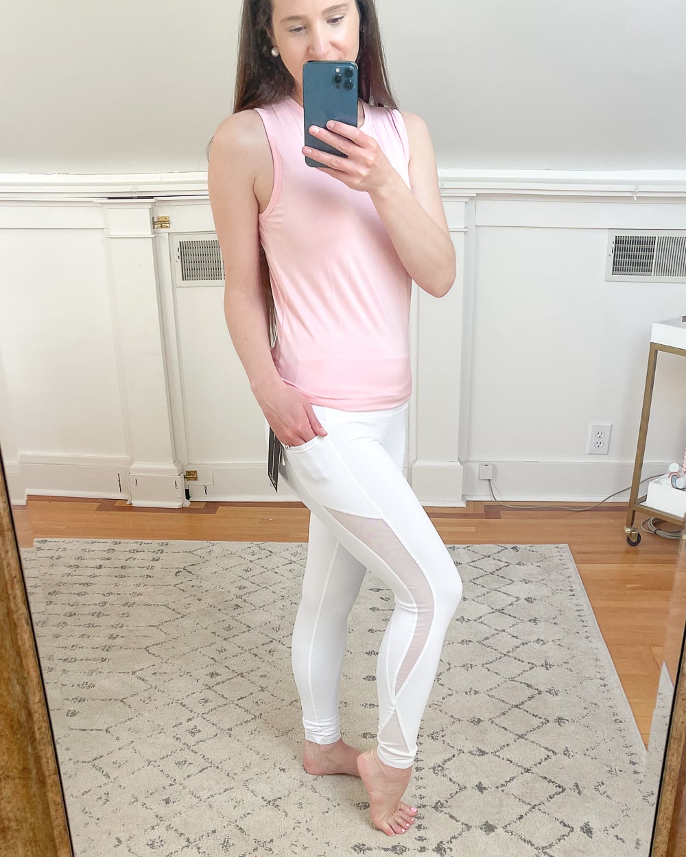 Affordable fashion blogger Stephanie Ziajka shows off the side mesh detail of her Amazon ONGASOFT white yoga pants on Diary of a Debutante