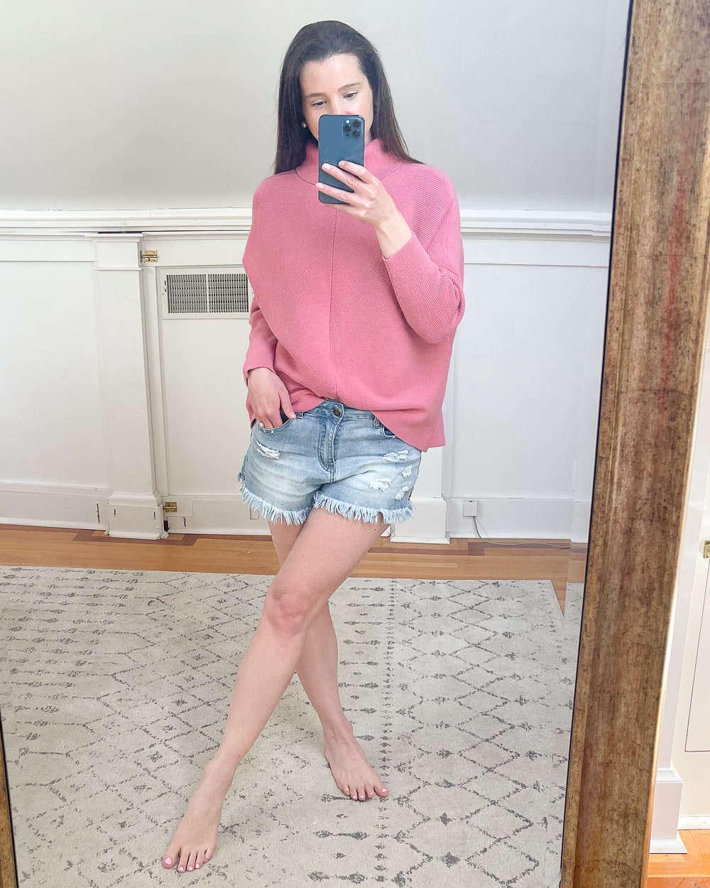Pink asymmetrical batwing sleeve sweater worn by affordable fashion blogger Stephanie Ziajka on Diary of a Debutante