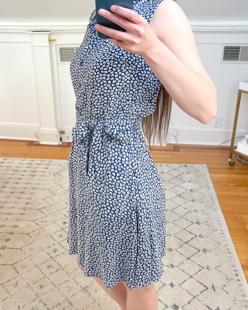 As part of her Amazon spring-try on haul, affordable fashion blogger Stephanie Ziajka shares a detail shot of her Amazon Essentials Women's Sleeveless Woven Shirt Dress in Navy White Pearls on Diary of a Debutante