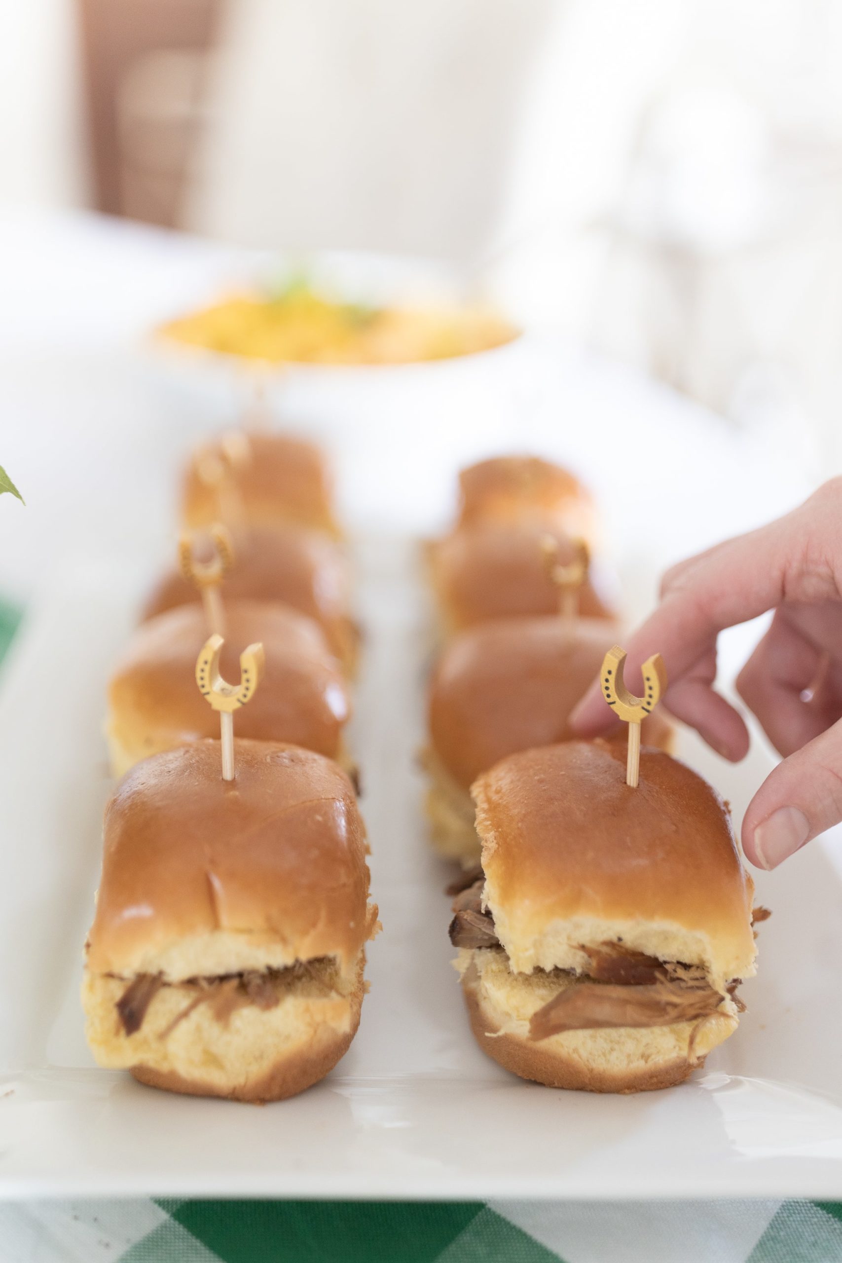 Bourbon pulled pork sliders served with gold horseshoe cocktail picks by southern blogger Stephanie Ziajka on Diary of a Debutante