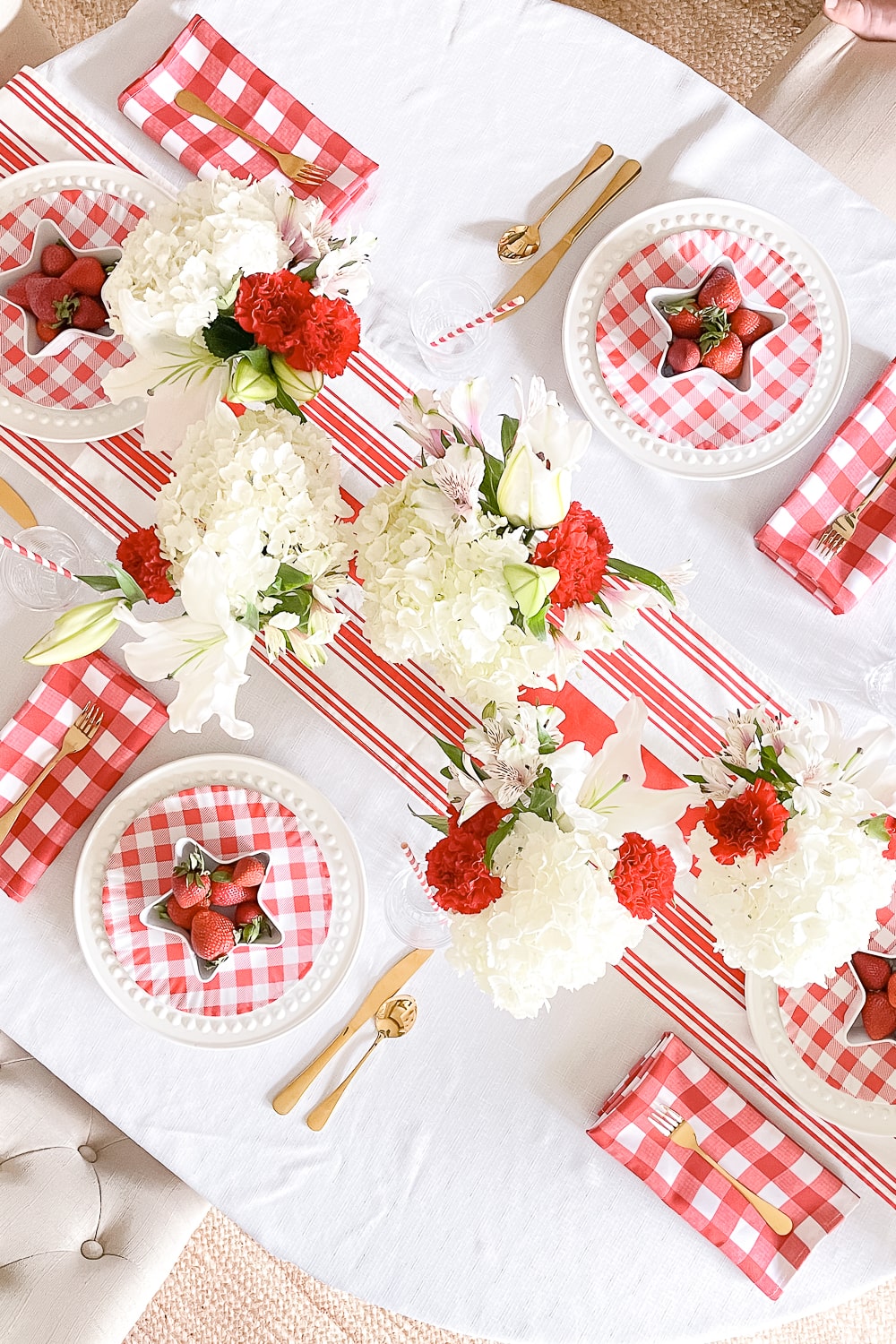 Simple patriotic table decor styled in an all red Memorial Day tablescape by blogger Stephanie Ziajka on Diary of a Debutante