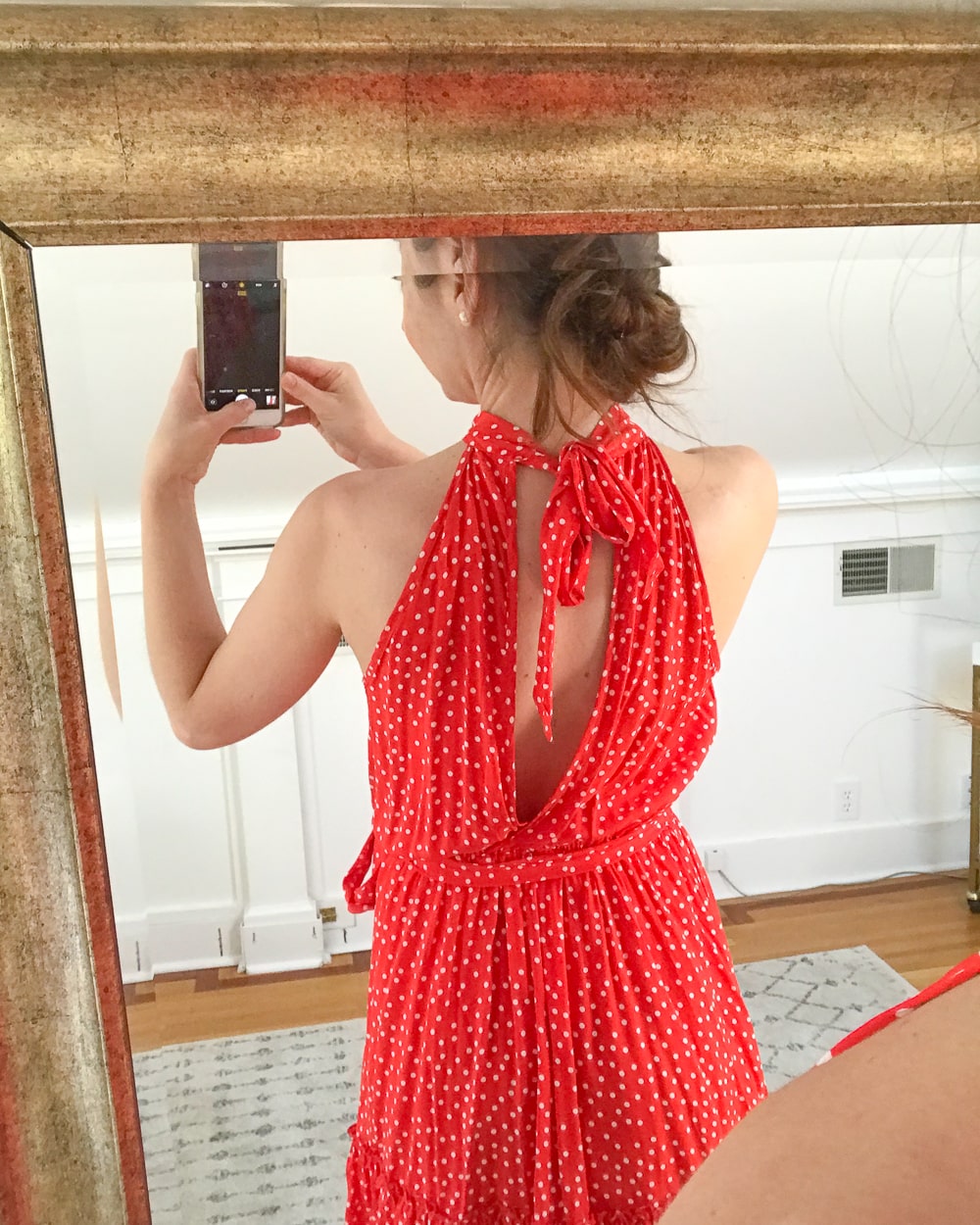 Affordable fashion blogger Stephanie Ziajka tries on an Amazon red halter dress on Diary of a Debutante