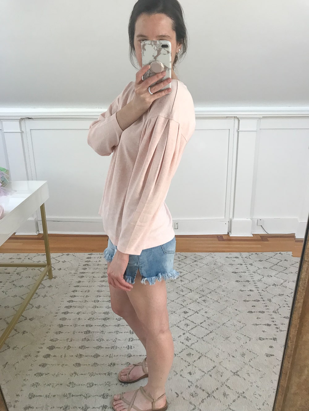 Affordable fashion blogger Stephanie Ziajka shows off the balloon sleeve detail of a pink Daily ritual top on Diary of a Debutante