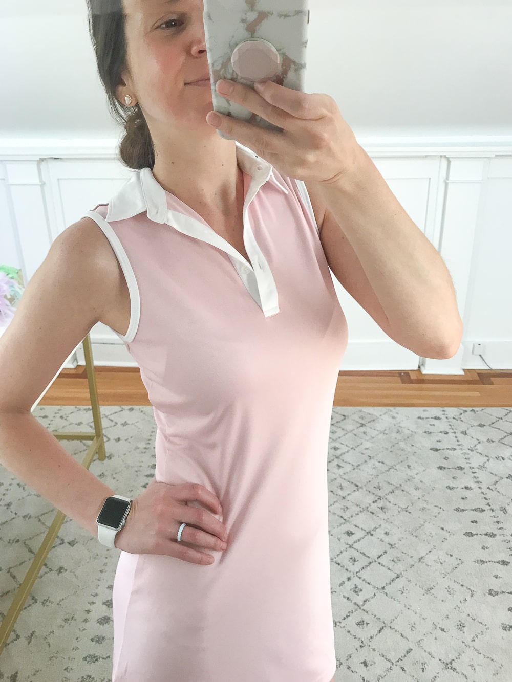 Affordable fashion blogger Stephanie Ziajka shows off the collar detail of a cute pink Amazon tennis dress on Diary of a Debutante