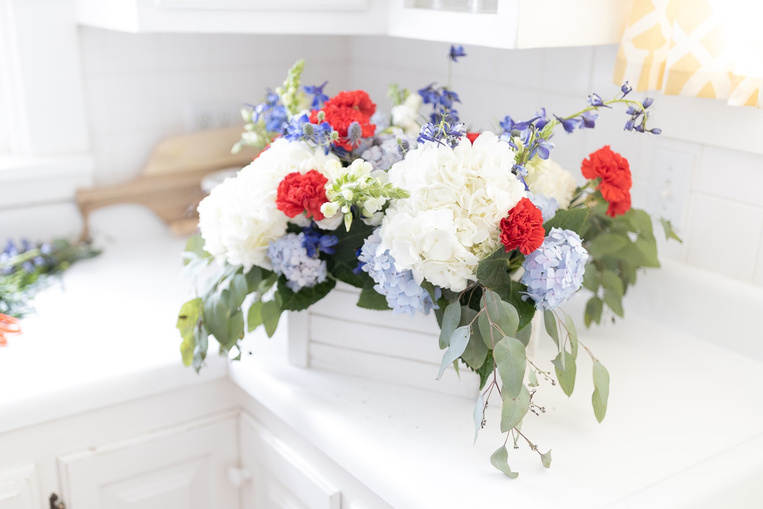 Red, white, and blue centerpiece created by entertaining blogger Stephanie Ziajka on Diary of a Debutante